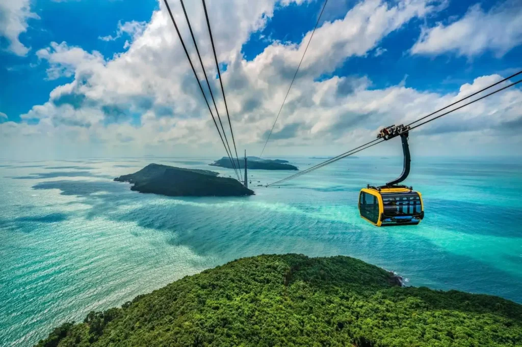 Families enjoy the scenic cable car journey across the turquoise sea. (Photo: Collected)