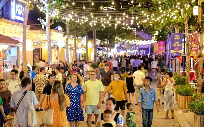 Visitors experience the vibrant nightlife at Sunset Town