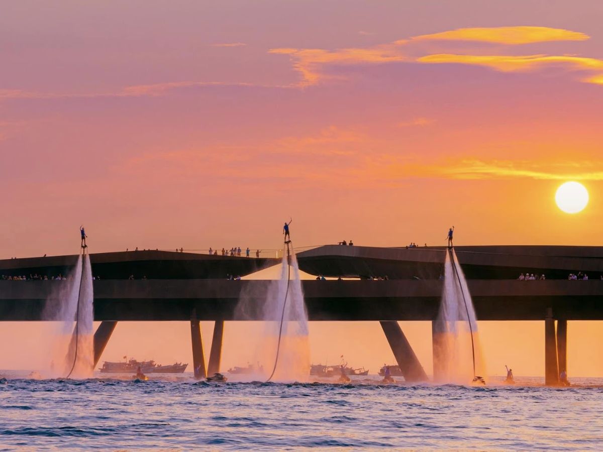 Kiss Bridge offers spectacular sunset views alongside thrilling Flyboard performances.