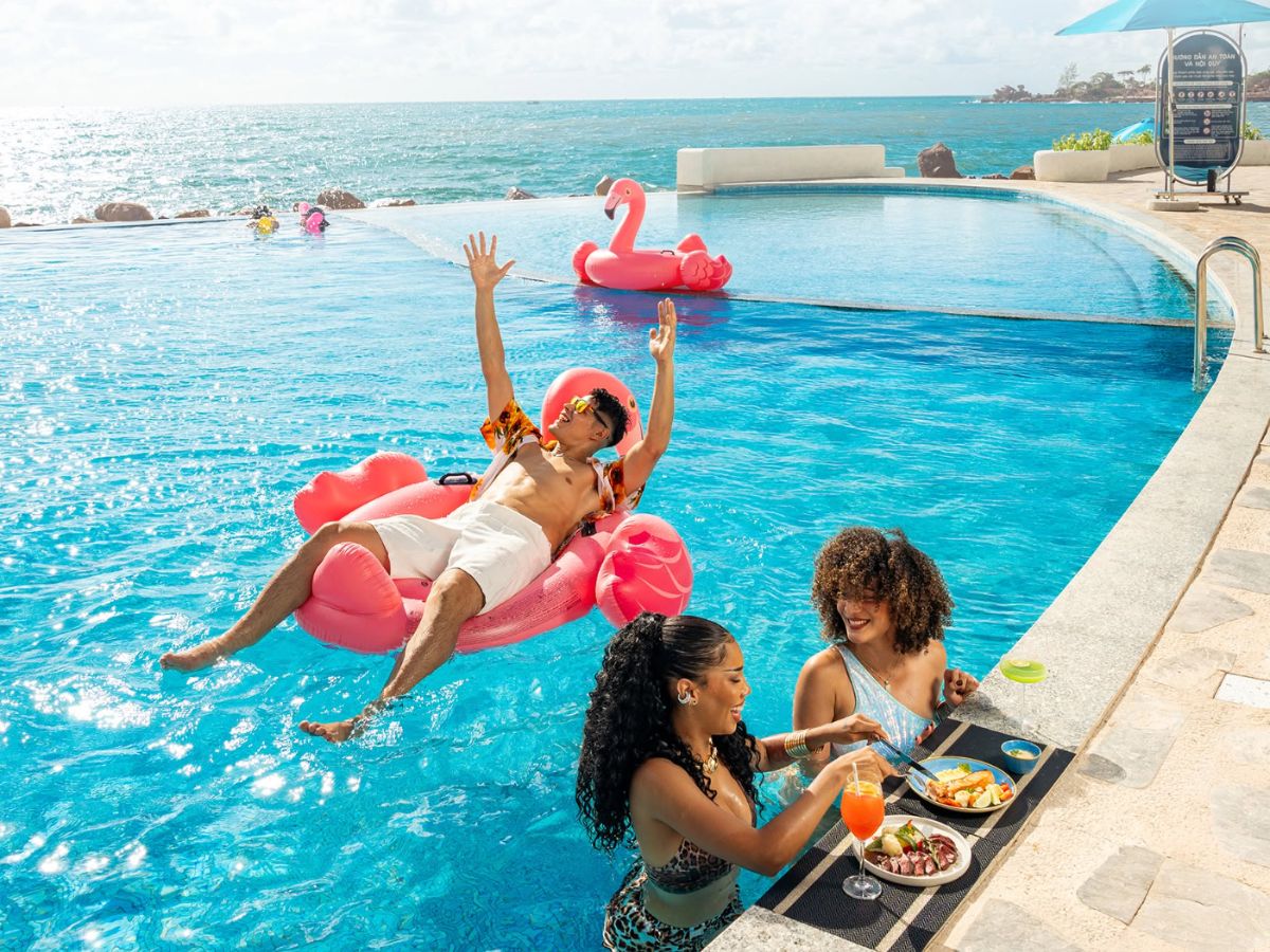 Enjoy a refreshing swim and tropical vibes at Santo Beach Club's infinity pool.