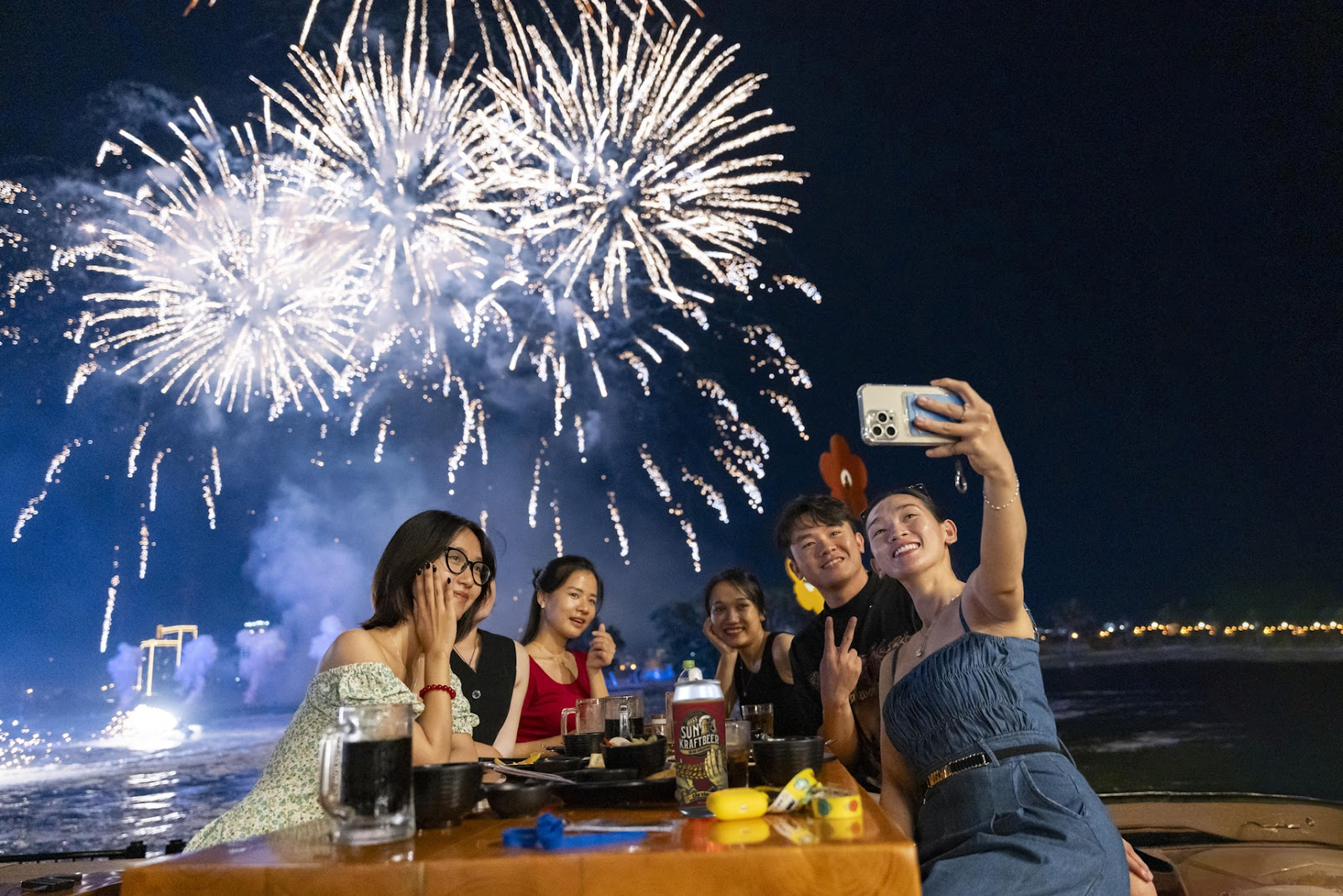 Tourists enjoy admiring the spectacular fireworks displays at Sunset Town