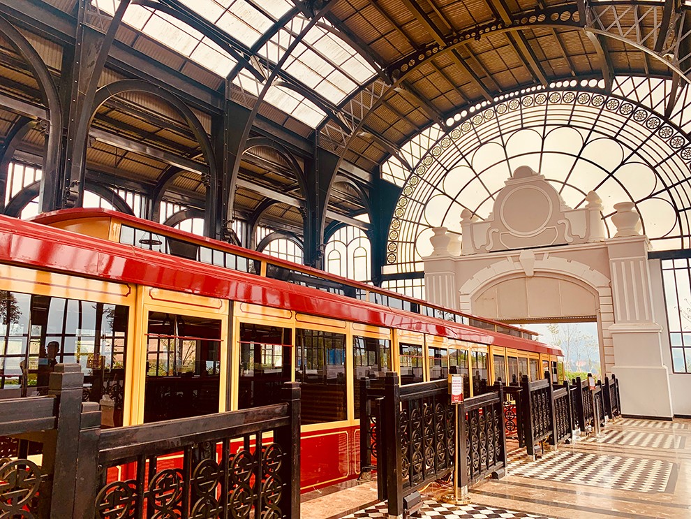 The Muong Hoa mountain climbing train is modern and vibrantly colored.