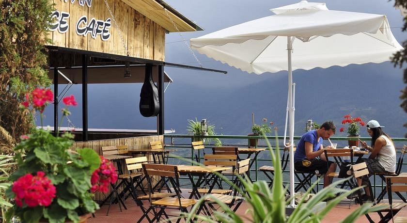 Coffee time on a garden terrace overlooking Sapa’s mountains