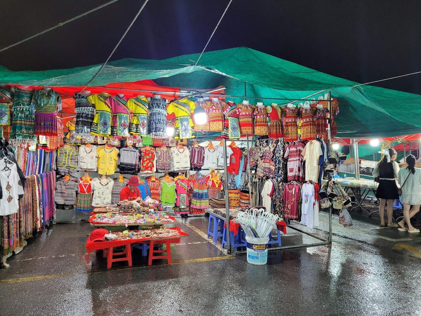 The Sapa night market sells traditional brocade clothing