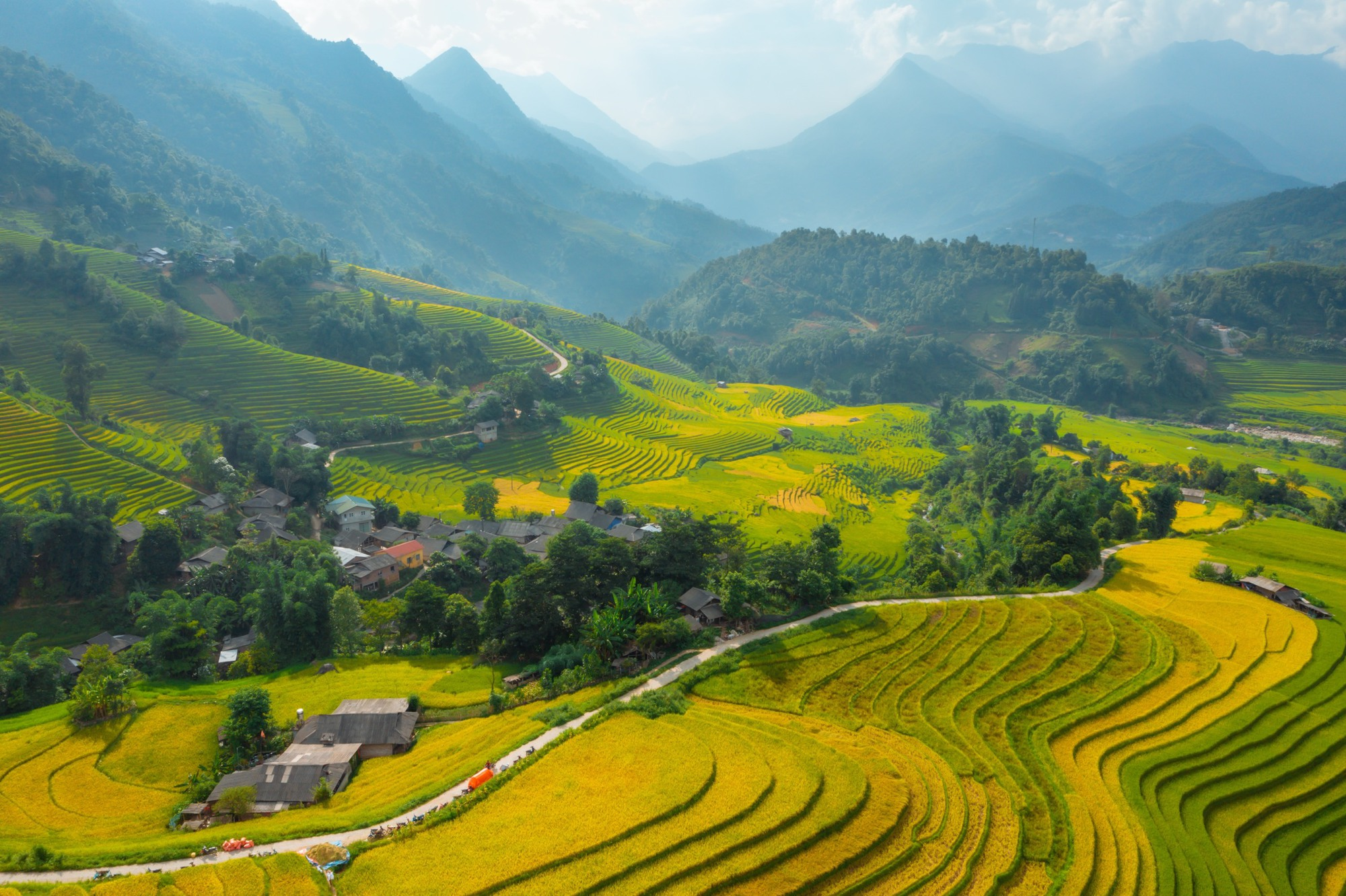 Terraced rice fields stretch across the mountains.