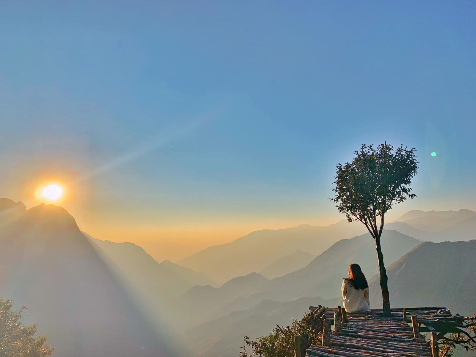 Tourists chase the sunrise at O Quy Ho Pass