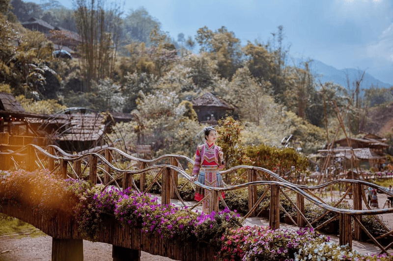 Tourists wearing traditional clothing experience ethnic culture in the villages