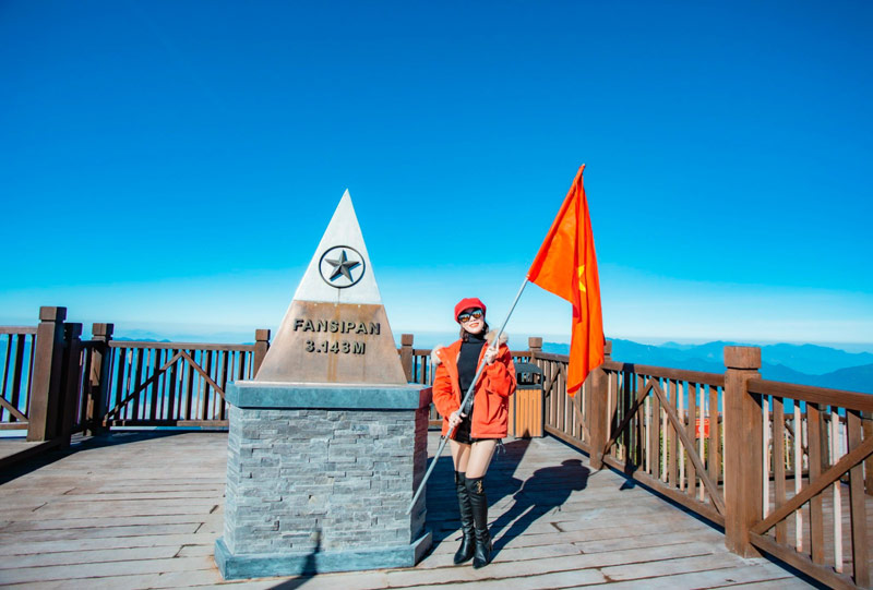 Tourists experience the summit of Fansipan