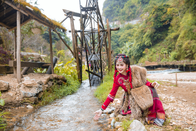 Tourists experience wearing traditional ethnic costumes in Cat Cat village