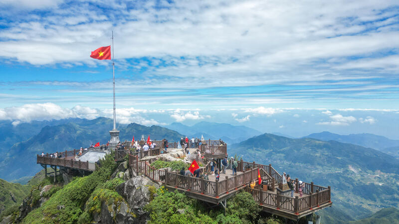 Tourists experience the summit of Fansipan