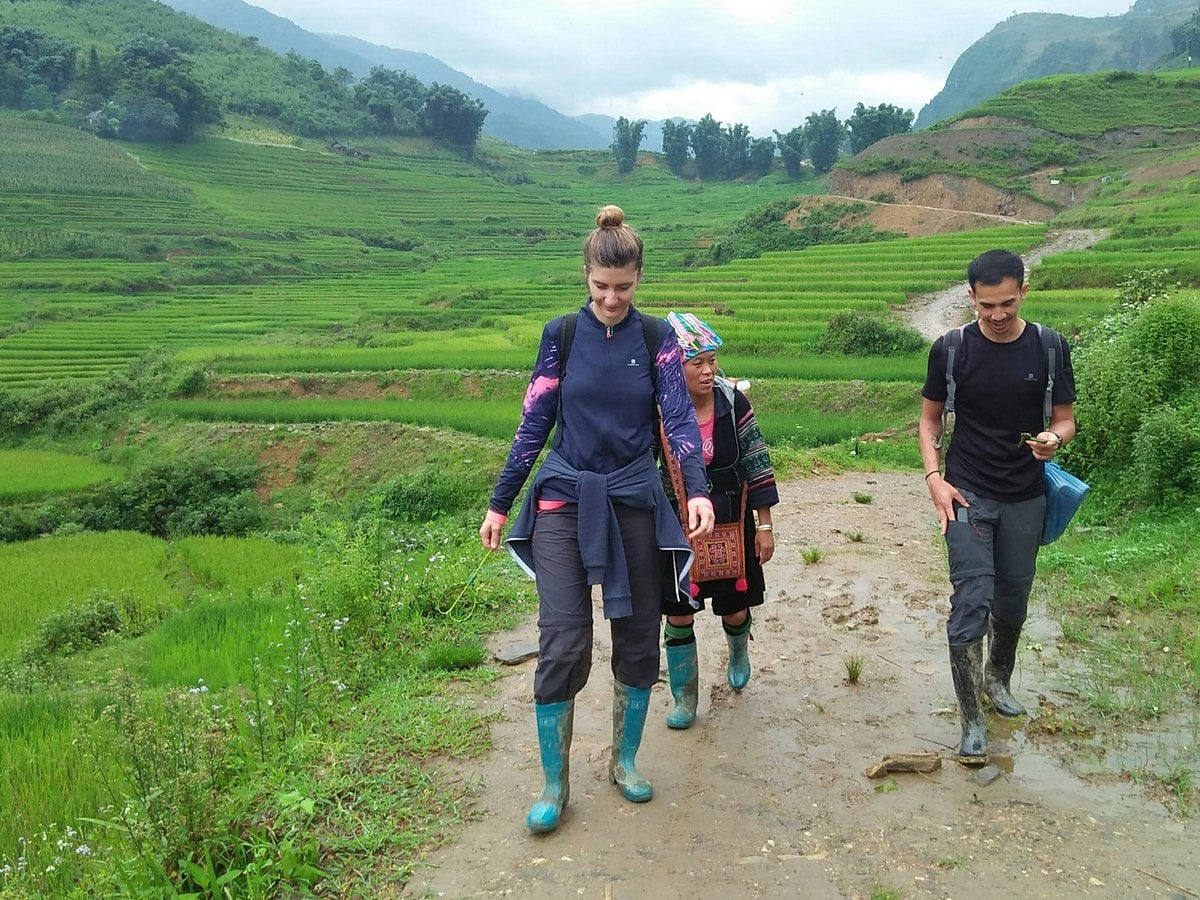 Tourists experience trekking through villages in Sapa