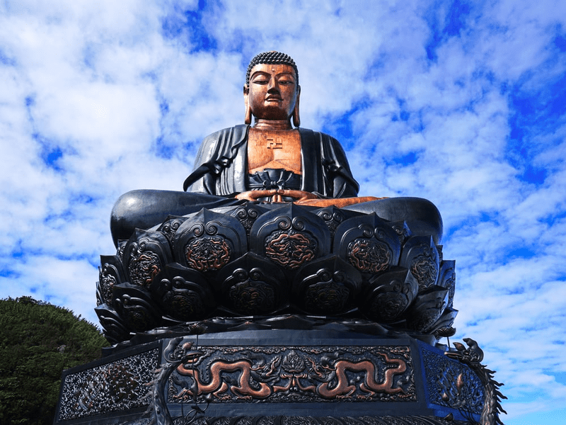 A close-up view of the giant Buddha statue on the summit of Fansipan