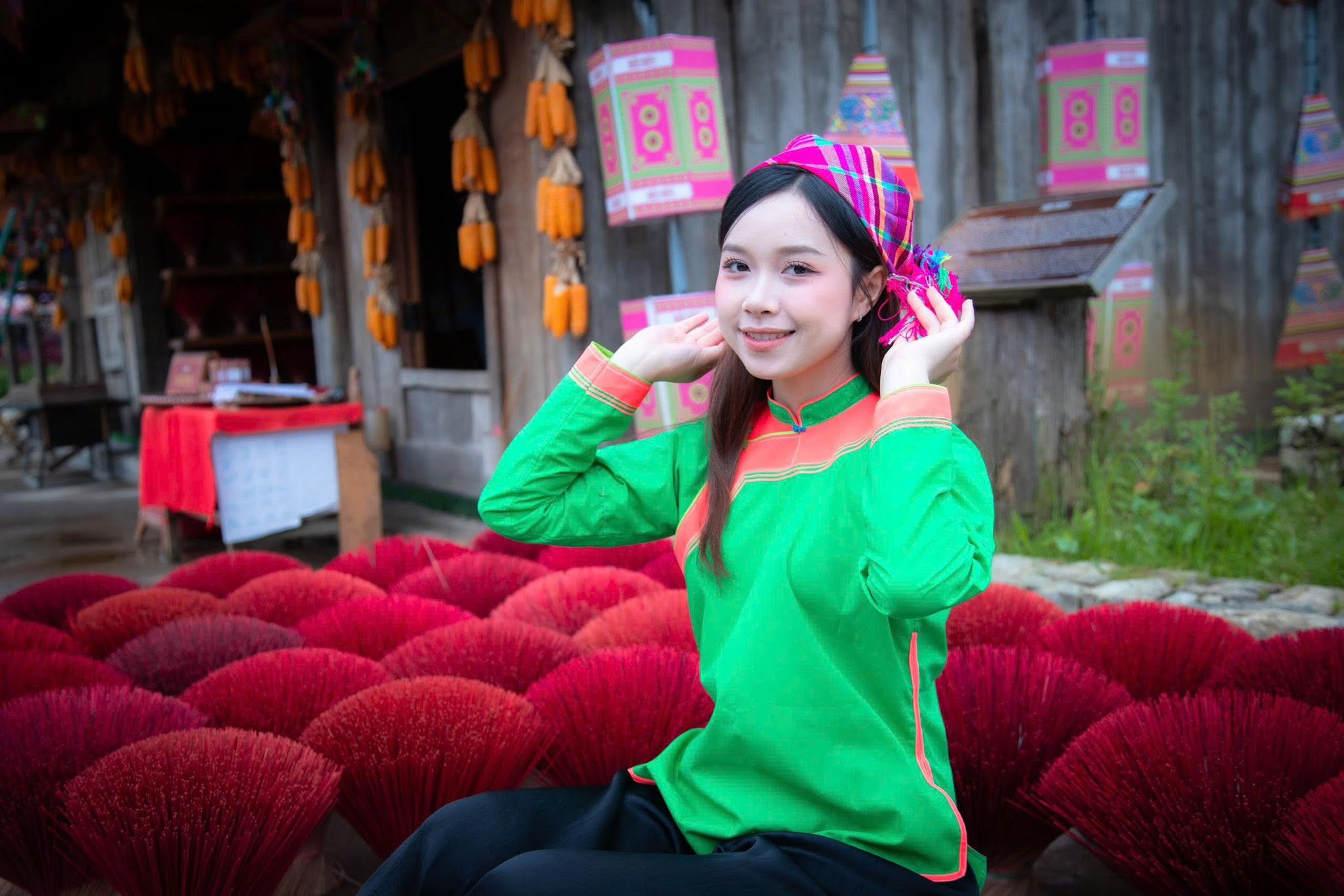 Visitors try on Giay ethnic costumes at May Village