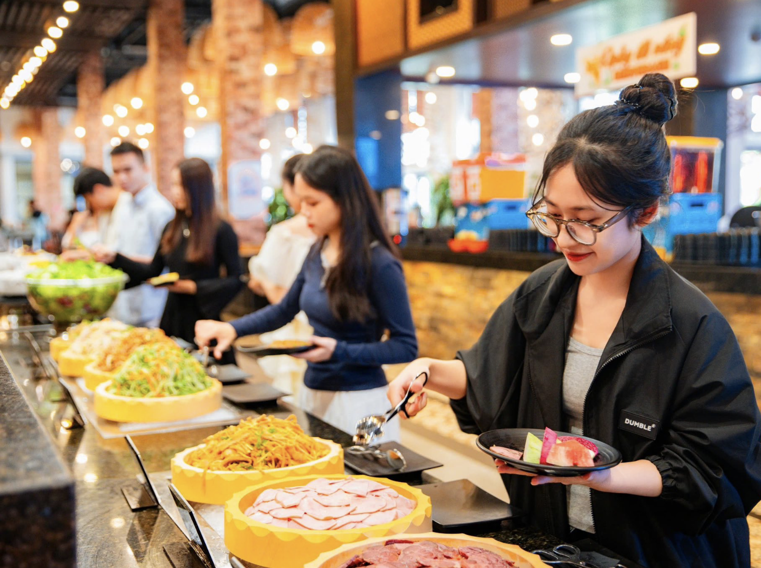 Visitors enjoying the culinary experience at Van Sam Buffet