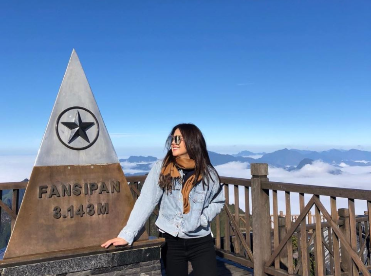 Tourists checking in at the 3,143m landmark on the summit of Fansipan