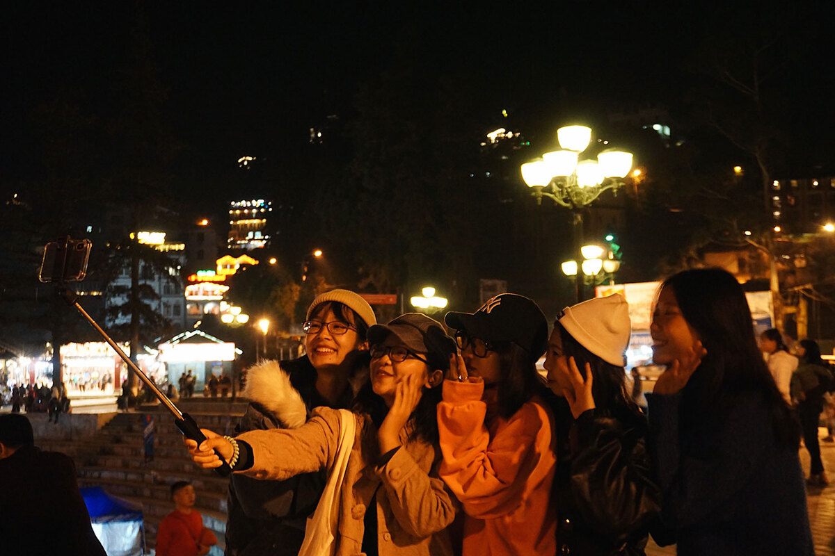 Tourists experiencing Sapa at night