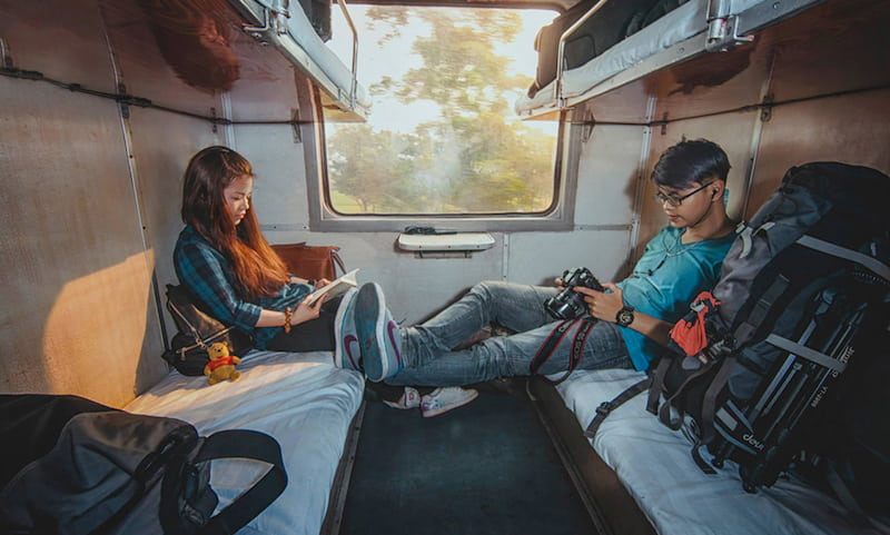 Travelers experiencing the train journey from Hanoi to Sapa