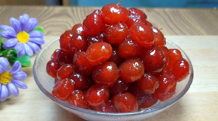 Jambul fruit preserve (Chum ruot) is usually enjoyed with a cup of tea.