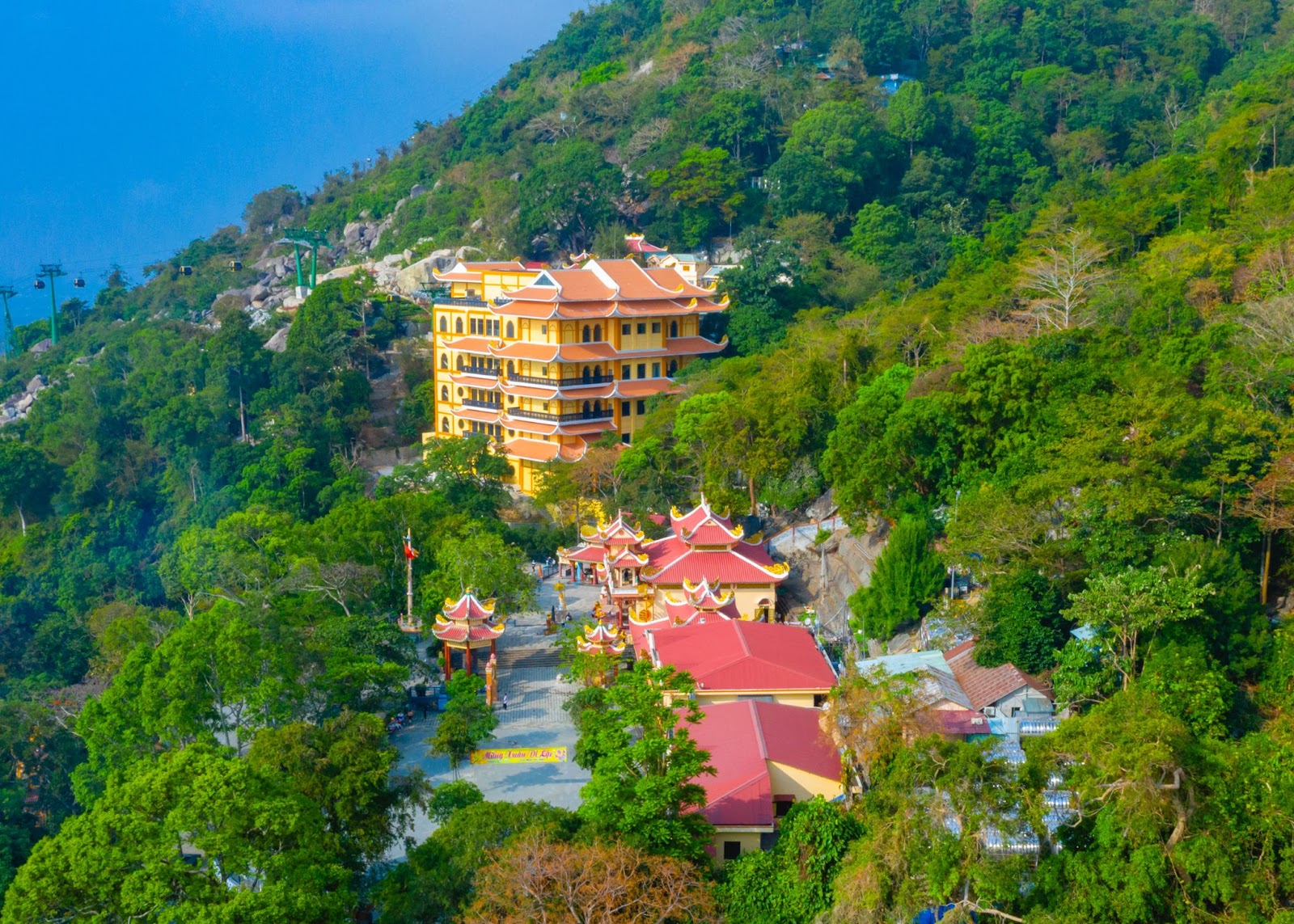 Hang Pagoda Station and Ba Pagoda by the lush green forest