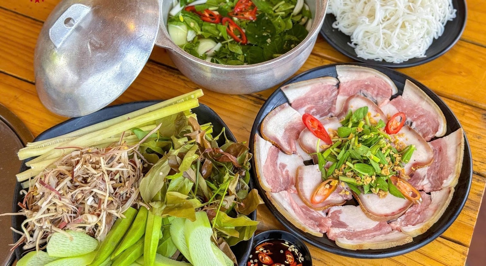 The dishes include meat dipped in soy sauce, beef shank wrapped in rice paper