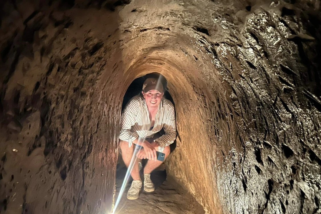 Visitors experience walking through the tunnels .