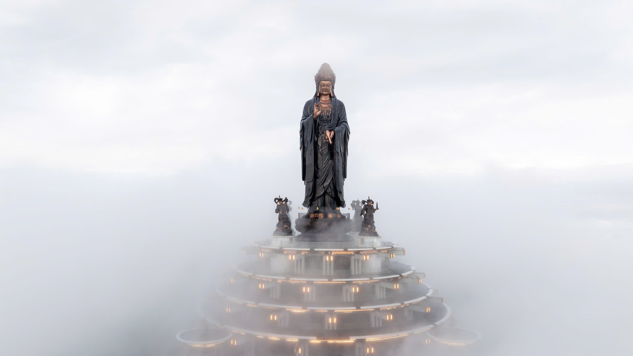The Tay Bo Da Son Bodhisattva statue symbolizes compassion atop the mountain peak