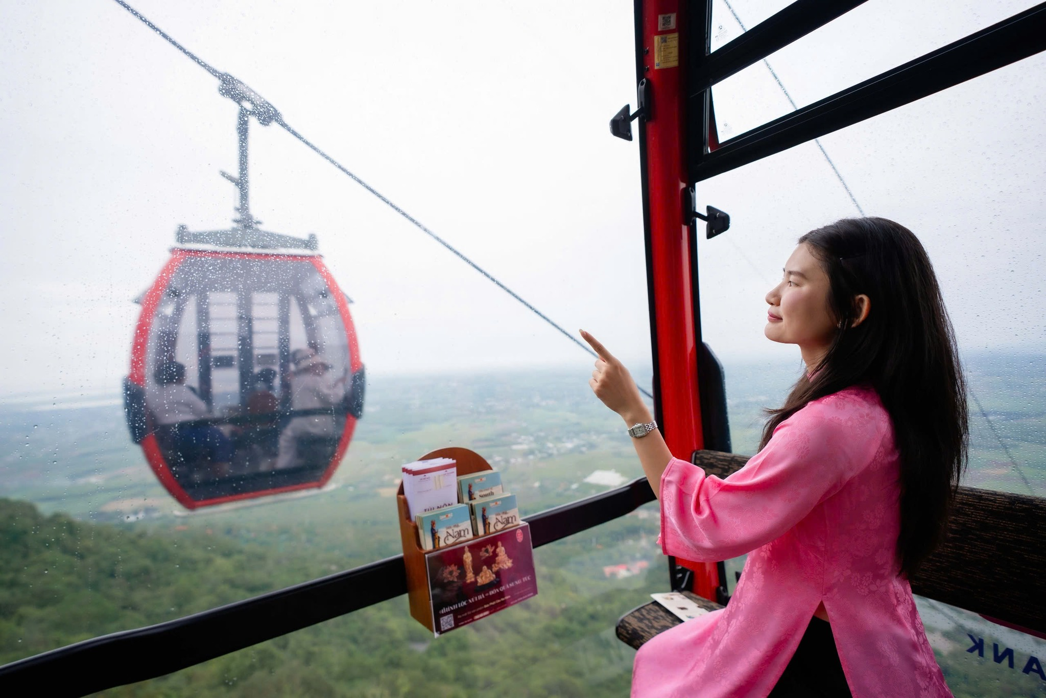 Tourists can admire the vast natural landscape from the cable car