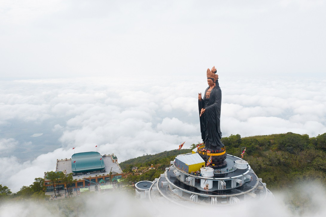 The majestic Tay Bo Da Son Bodhisattva statue stands atop the mountain