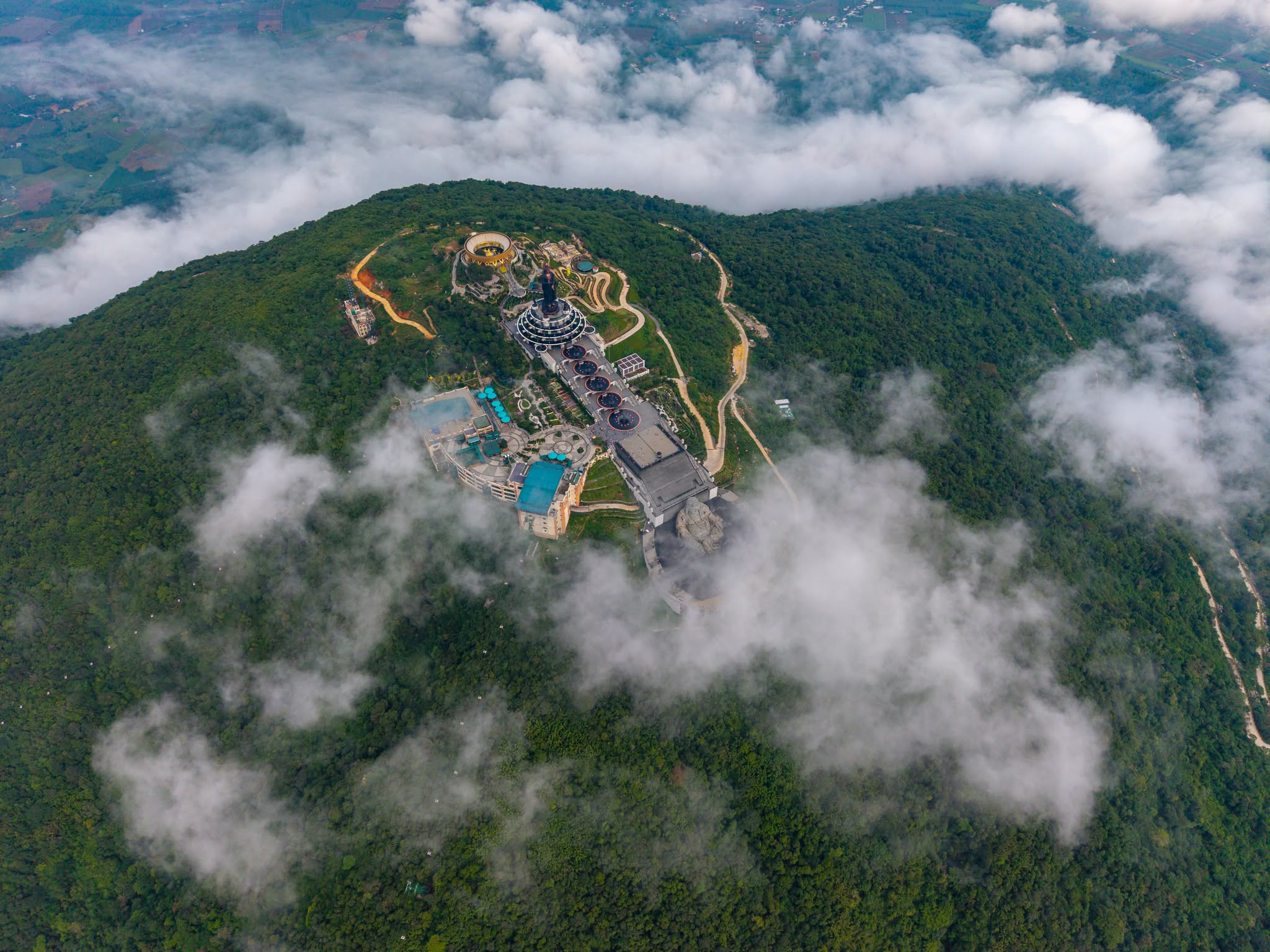 Admire the magnificent Buddha statue on the summit of Ba Den Mountain.