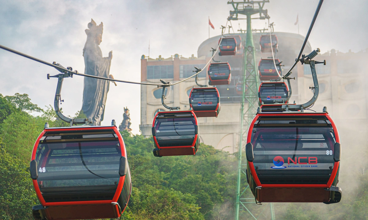 The modern cable car system makes it easy for tourists to conquer the mountain peak