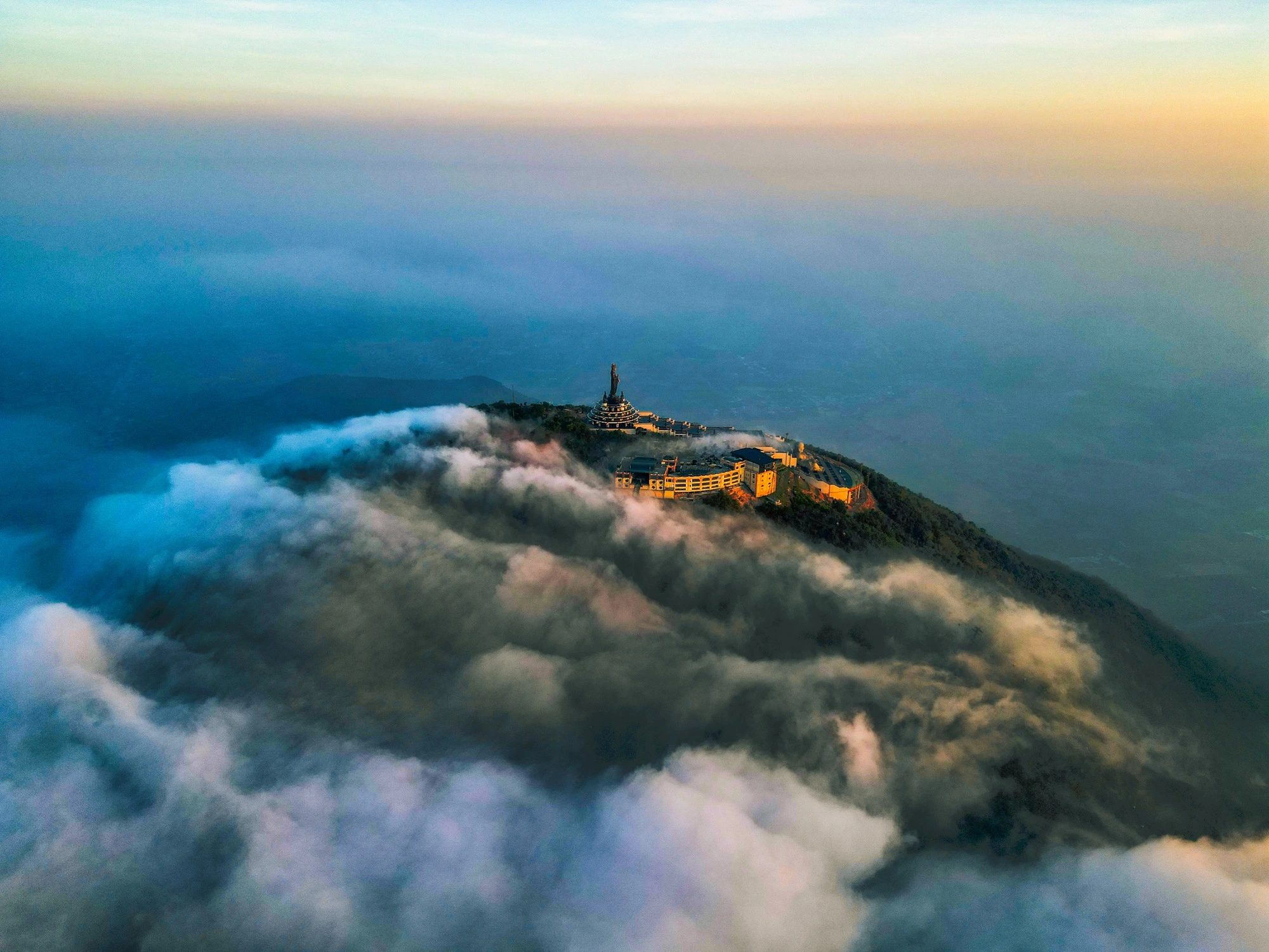 The Tay Bo Da Son Bodhisattva Statue is hidden amidst a sea of clouds