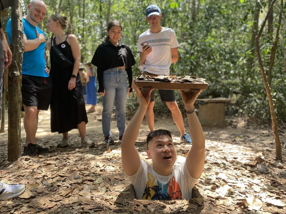 Tourists are excited to explore the Cu Chi Tunnels