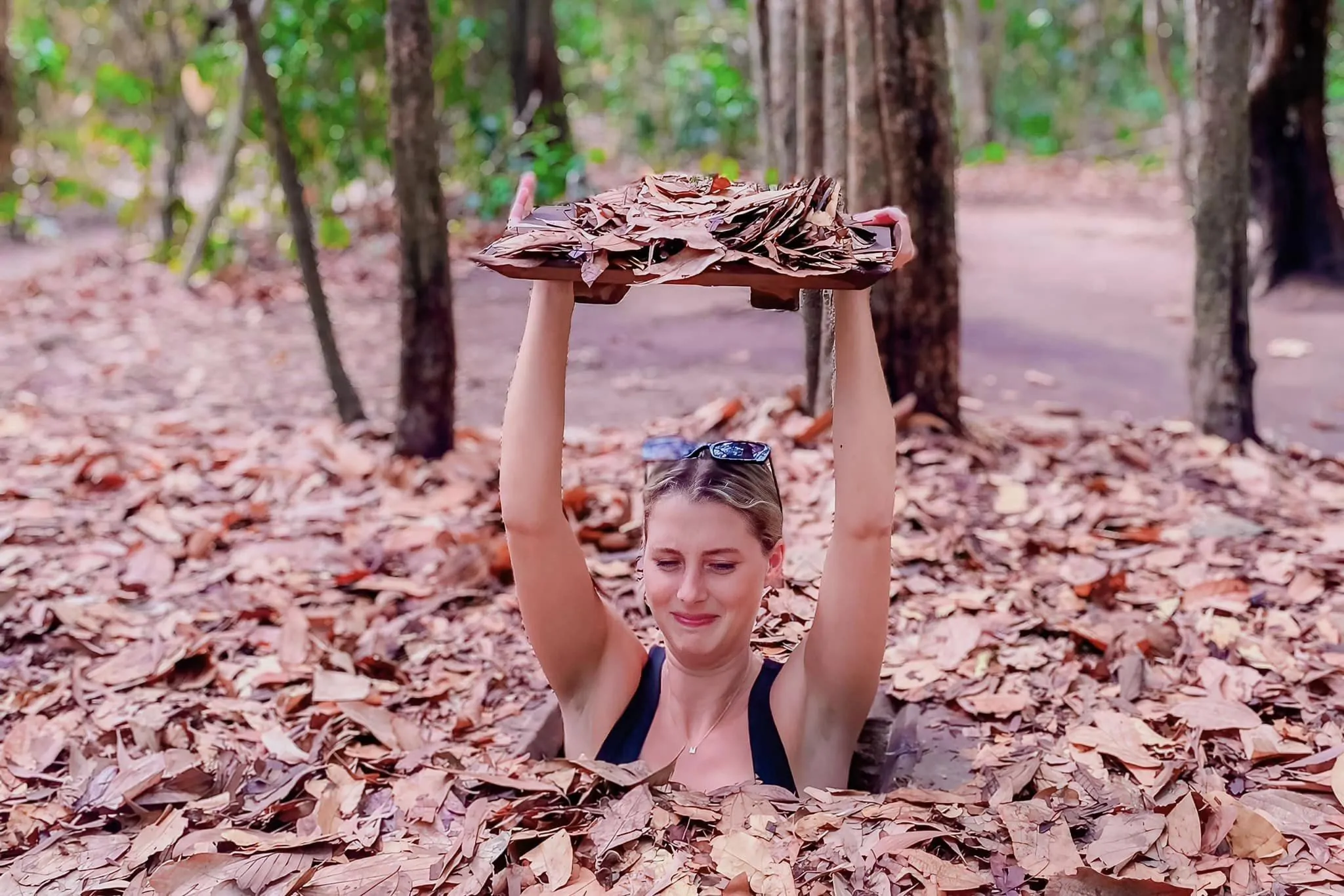 Tourist explores the Cu Chi Tunnels